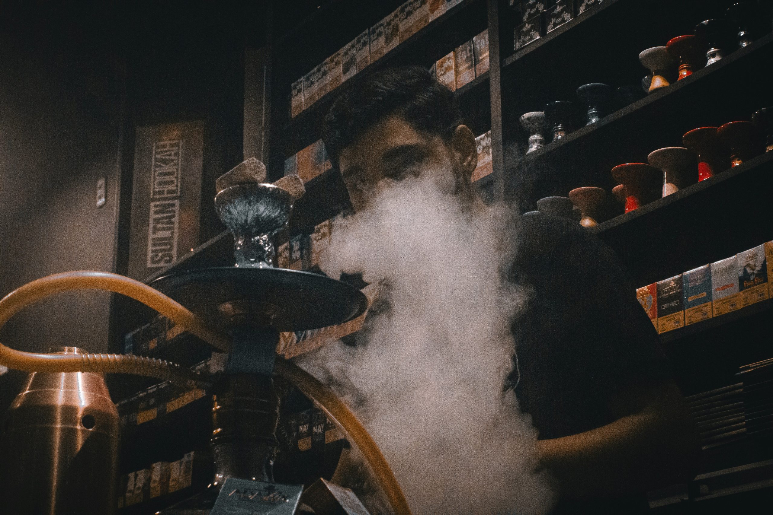 Home man-smoking-hookah-tobacco