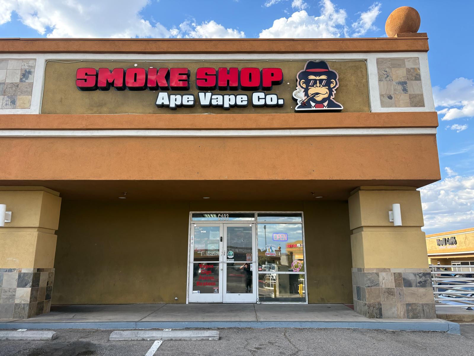 Contact Ape Vape storefront with the red Smoke Shop and Ape Vape Co. sign above the entrance.